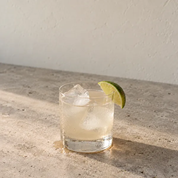 Kava Moon Pure Canvas over ice with a lime wedge